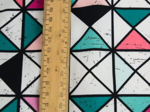Tissu imprimé motifs géométriques / triangles au mètre | Atelier Inika